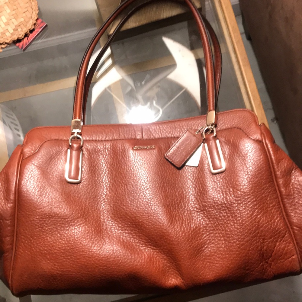 Cognac Coach bag.